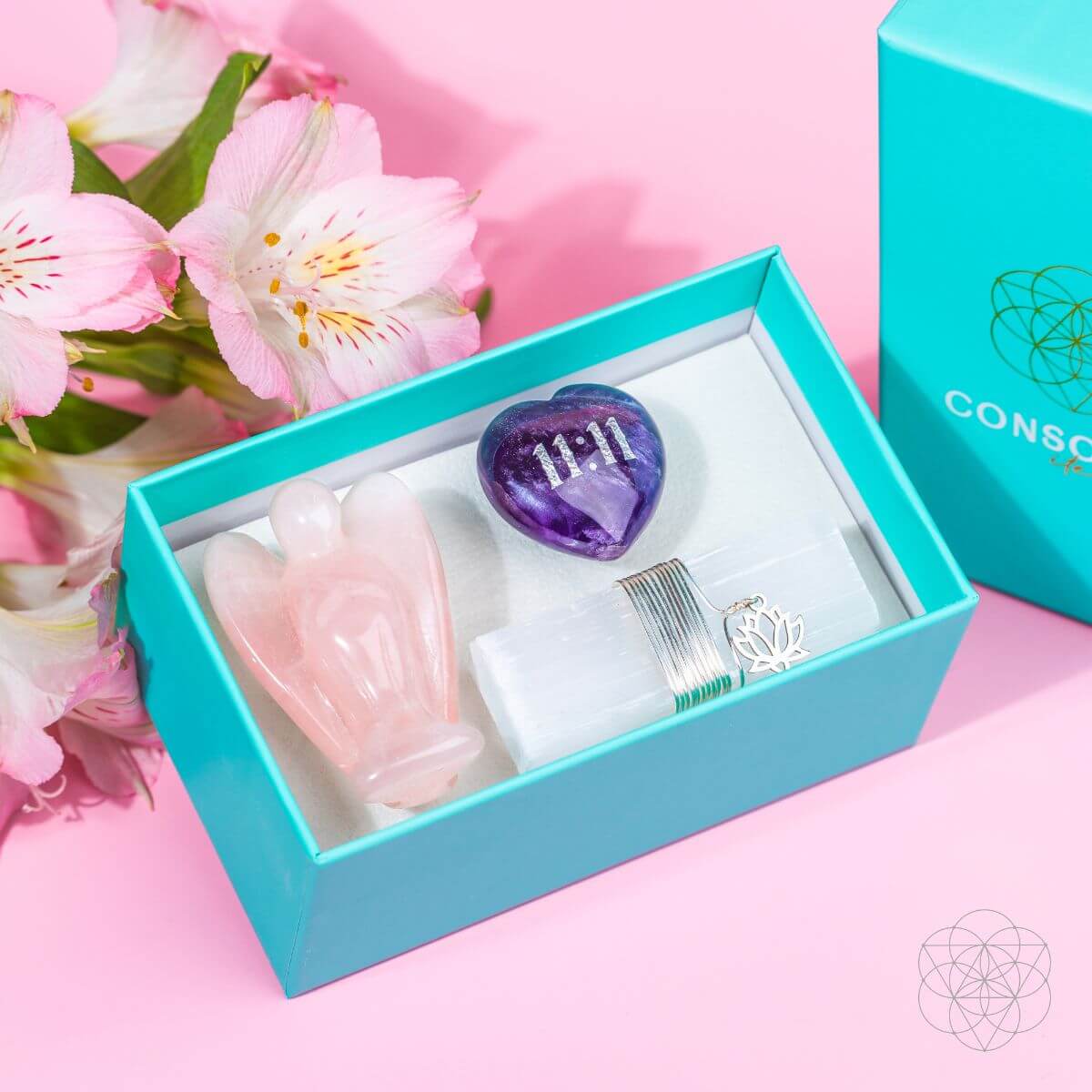 The 11:11 blessed car crystal kit nestled securely inside a premium teal blue gift box with protective inserts, ready for gifting.