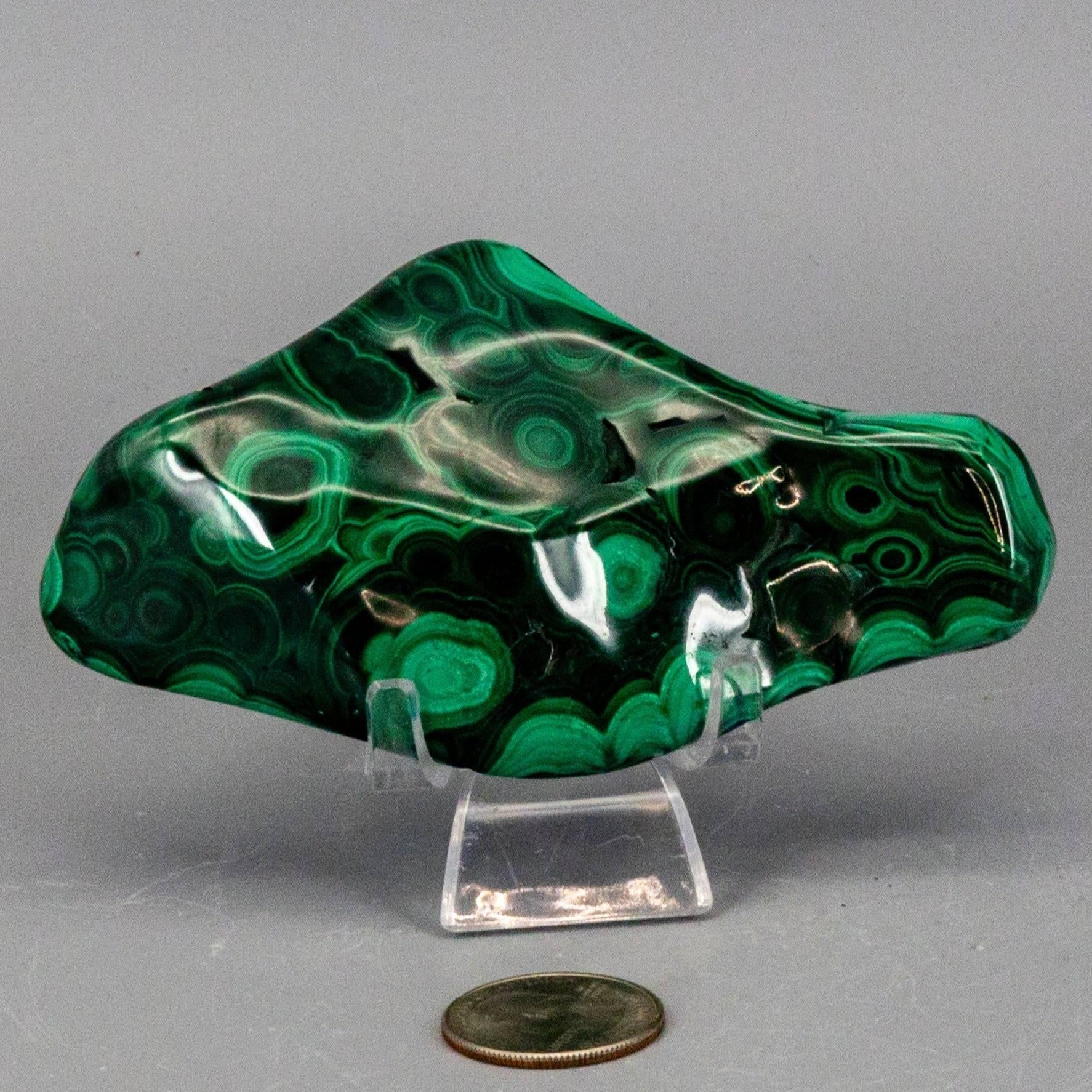 Elongated horizontal polished green malachite freeform specimen showcasing wavy light and dark green lines.
