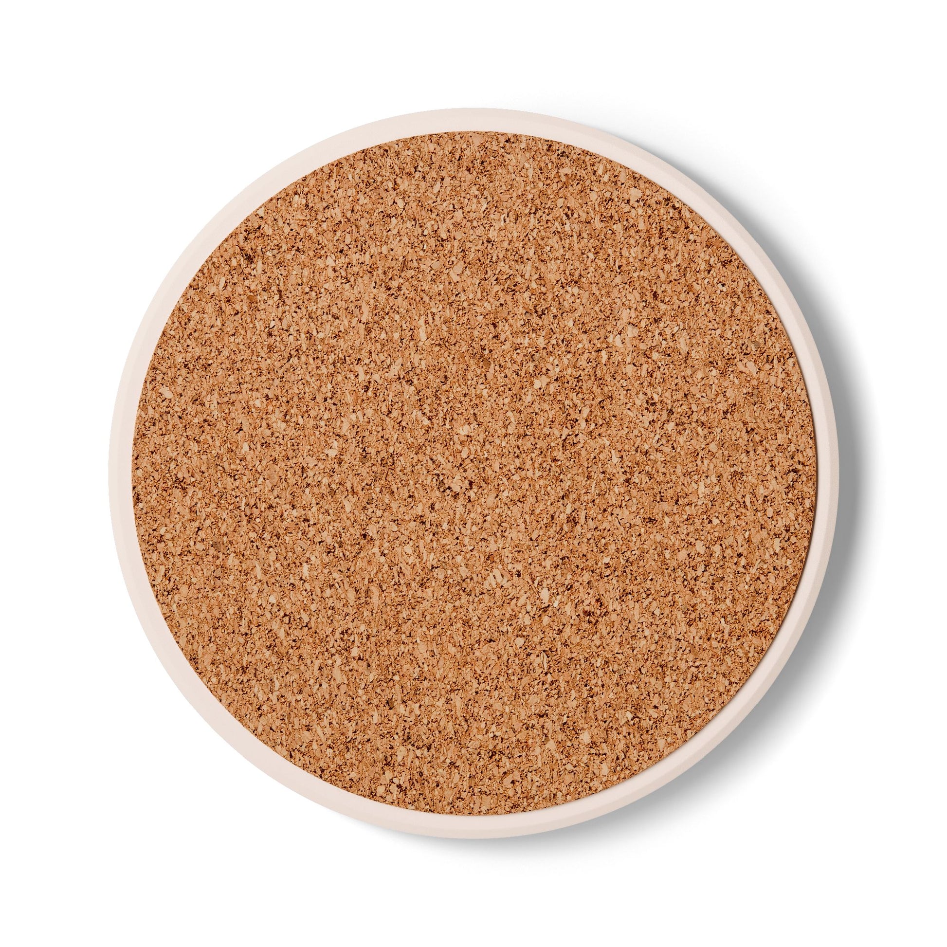 Rear view of the round ceramic coaster showing the textured, non-slip natural brown cork backing.